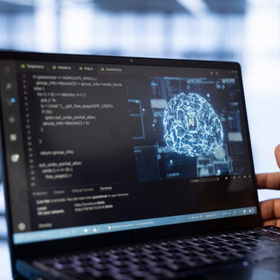 Computer scientist using laptop in data center, updating AI systems. Close up shot of device used by server room worker upgrading artificial intelligence simulation model