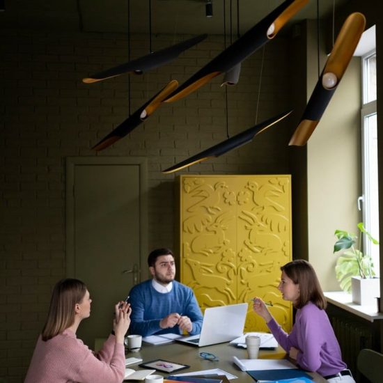medium-shot-people-chatting-desk_23-2149345216